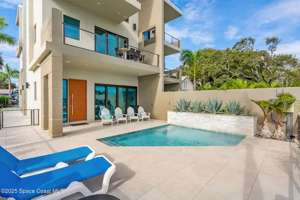 aerial view of a house with swimming pool