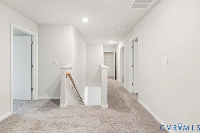 a view of a hallway with staircase