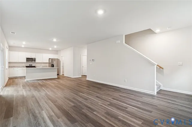 a view of kitchen with wooden floor