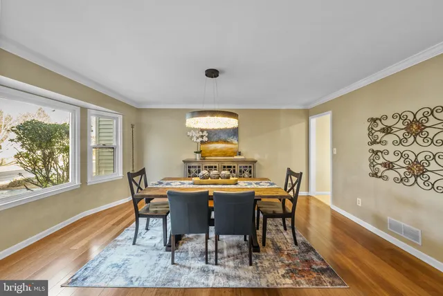 a view of a livingroom with furniture and a flat screen tv
