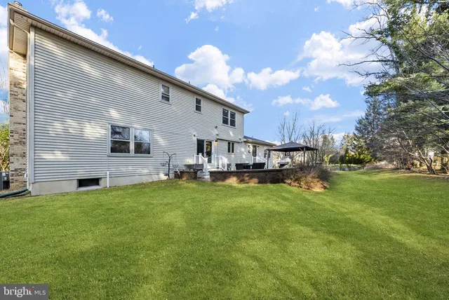 an aerial view of residential houses with yard