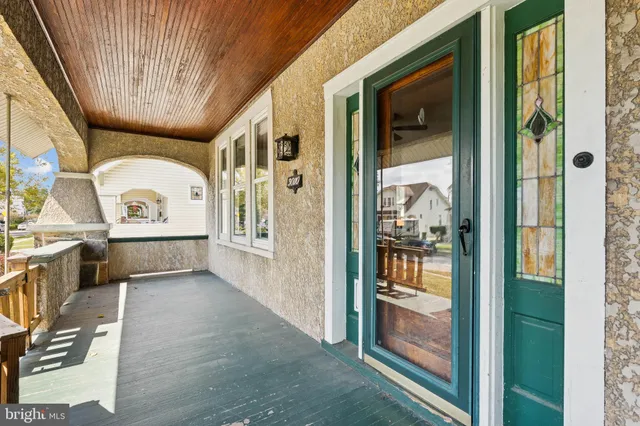 a view of a hallway with a dining table