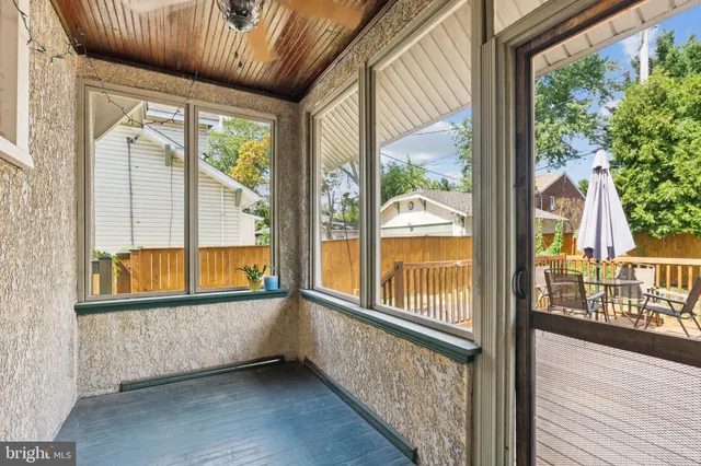 a view of a hallway and wooden floor