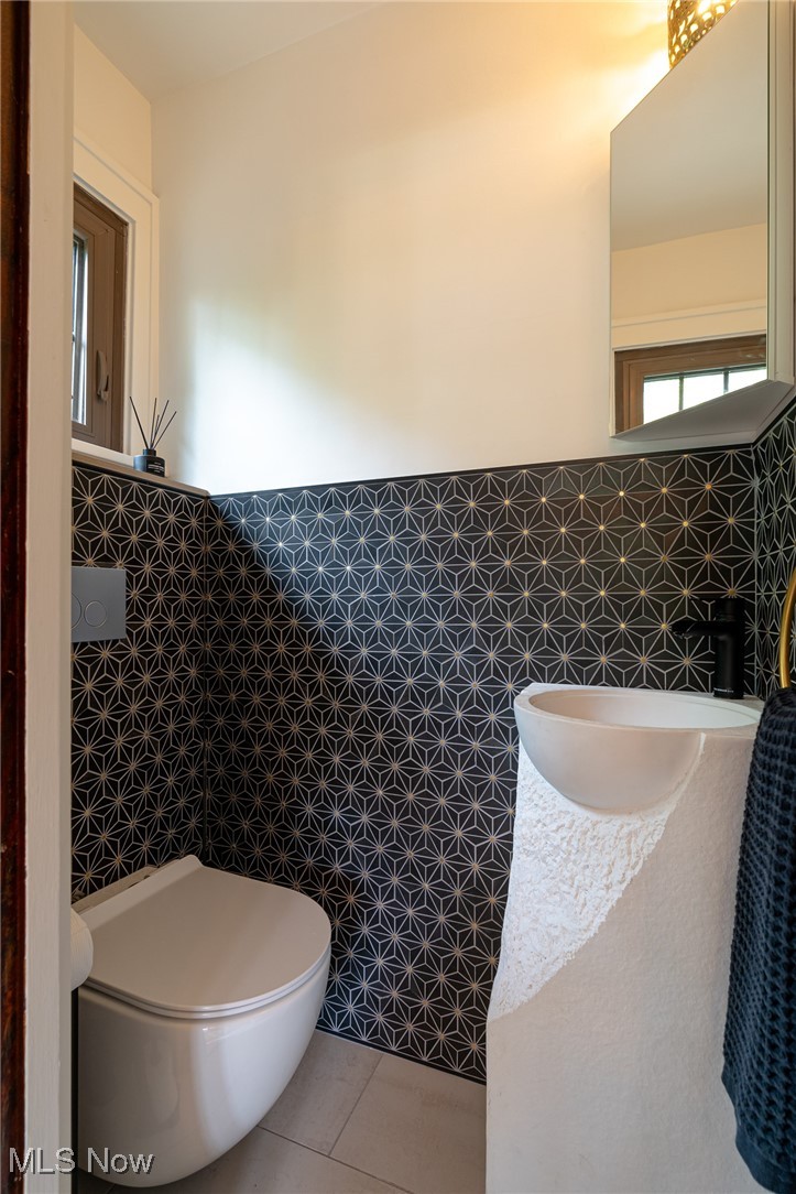 2624 Lee Road Cleveland, OH 44118 - Photo 17 of 50 luxury toilet, tile and artisan sink make this half bath a true one of a kind