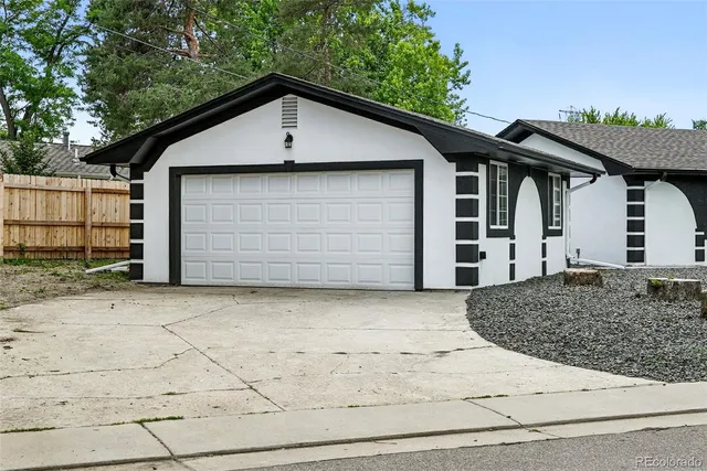 a front view of a house with garage