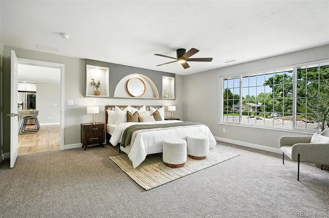 a bed room with a bed and a large window