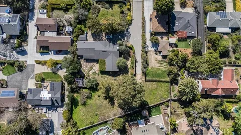an aerial view of multiple houses with outdoor space