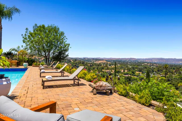 a view of a ocean with a lounge chair