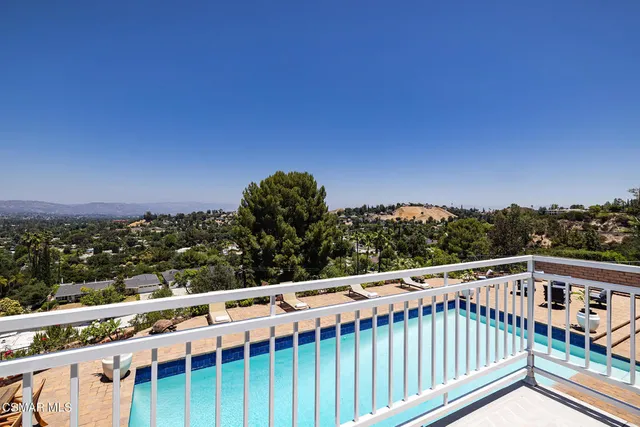 a view of a balcony with an outdoor space