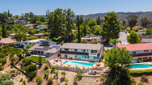 an aerial view of houses with yard