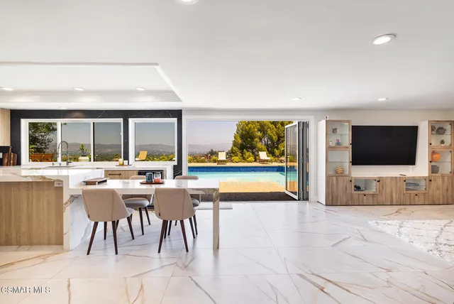 a view of a living room and a flat screen tv