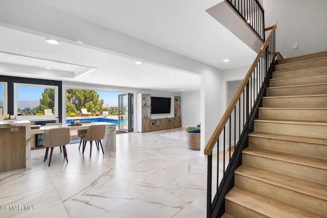 a view of a dining room with furniture window and outside view