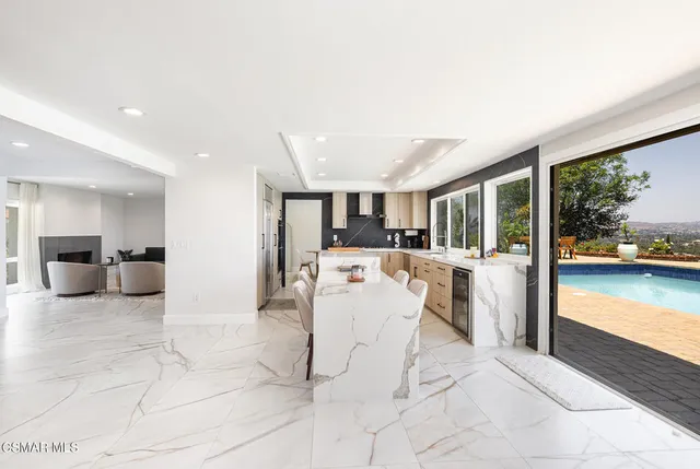 a view of a living room and kitchen with furniture and a kitchen view