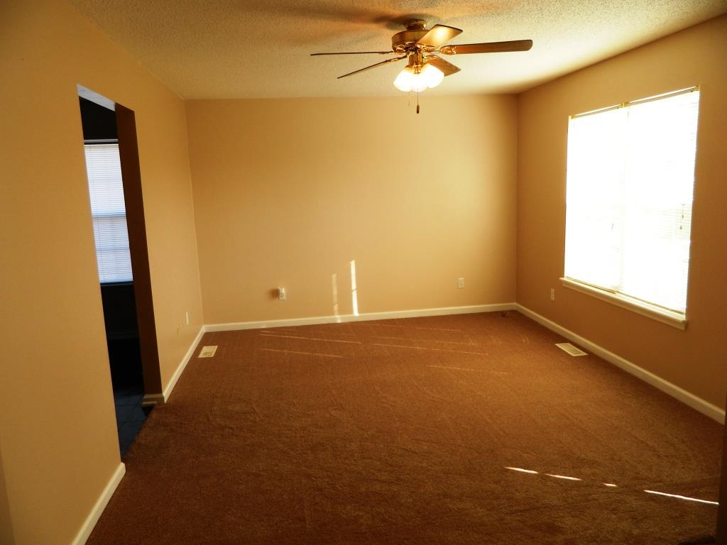 111 Miranda Road Cadiz, KY 42211 - Photo 3 of 15 an empty room with windows and entrance