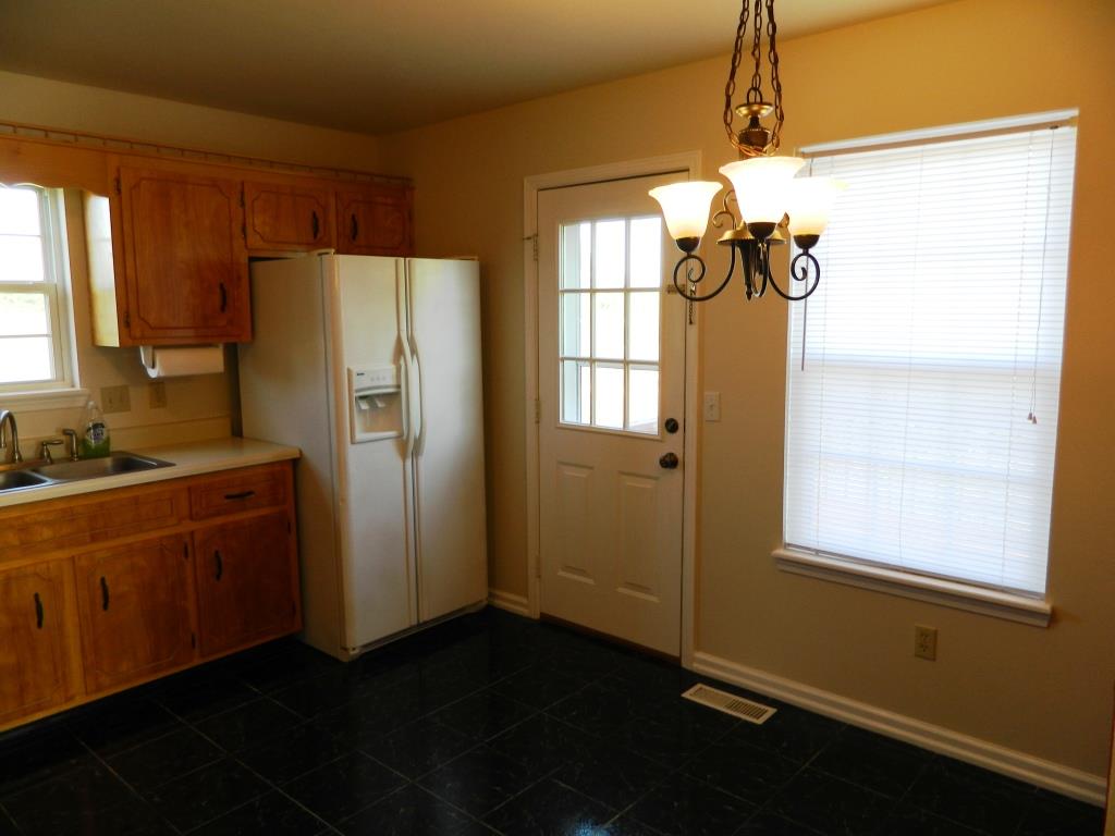 111 Miranda Road Cadiz, KY 42211 - Photo 5 of 15 a kitchen with stainless steel appliances granite countertop a refrigerator and a sink