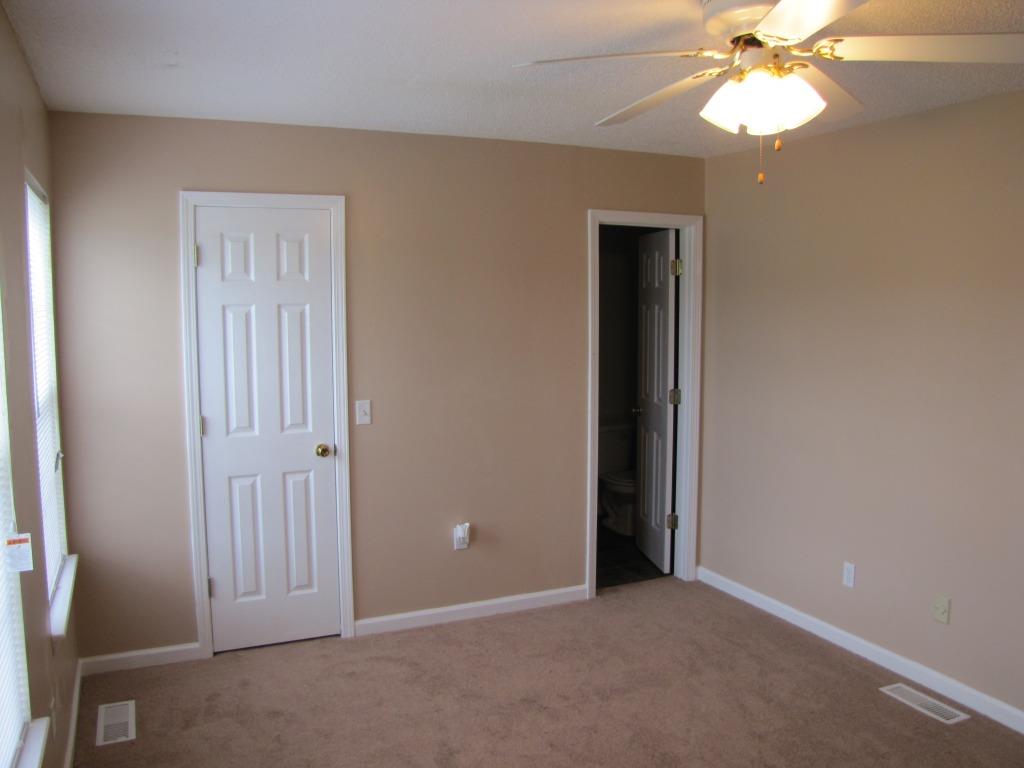 111 Miranda Road Cadiz, KY 42211 - Photo 9 of 15 an empty room with windows and fan