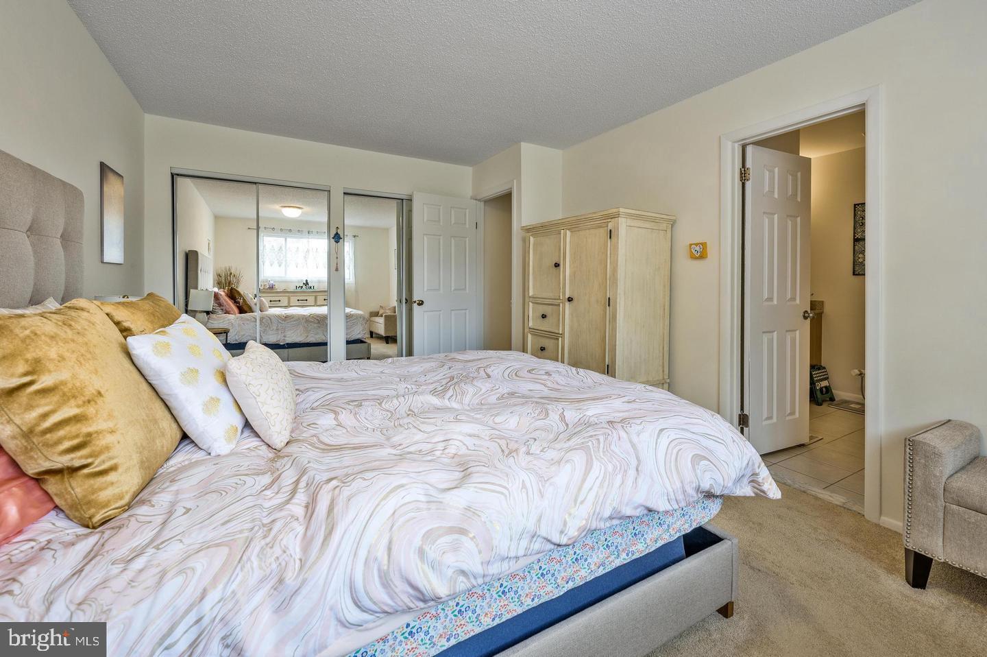 56 Dover Drive Lindenwold, NJ 08021 - Photo 7 of 13 a bedroom with a bed and mirror