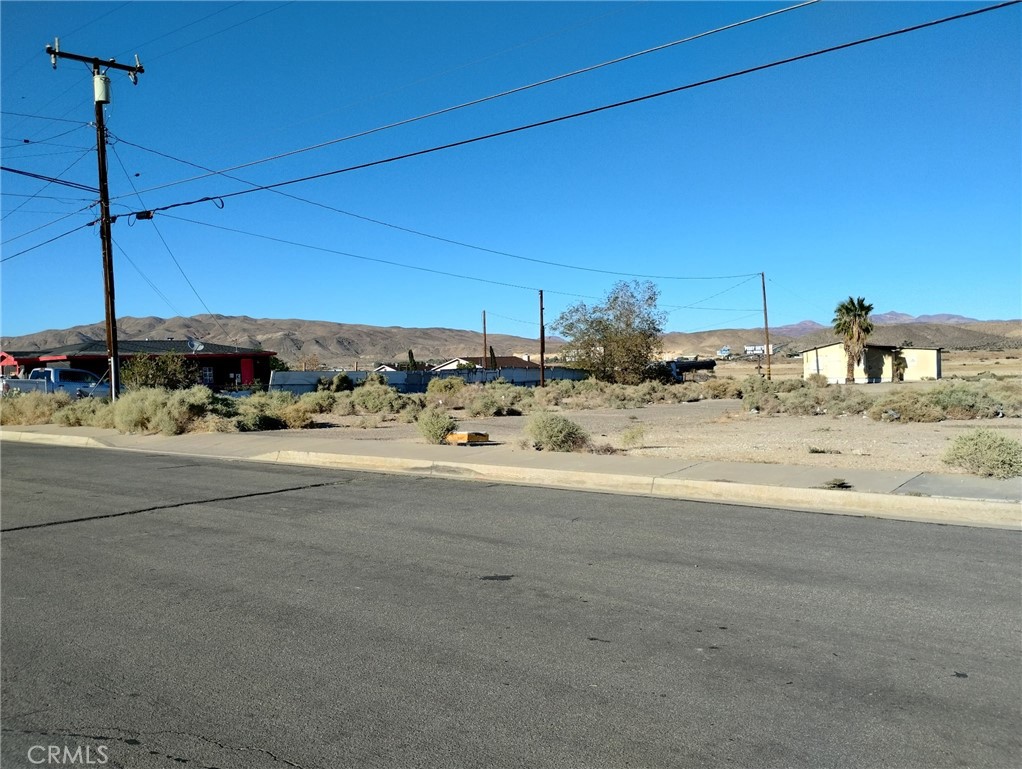 a view of a water fountain and a yard
