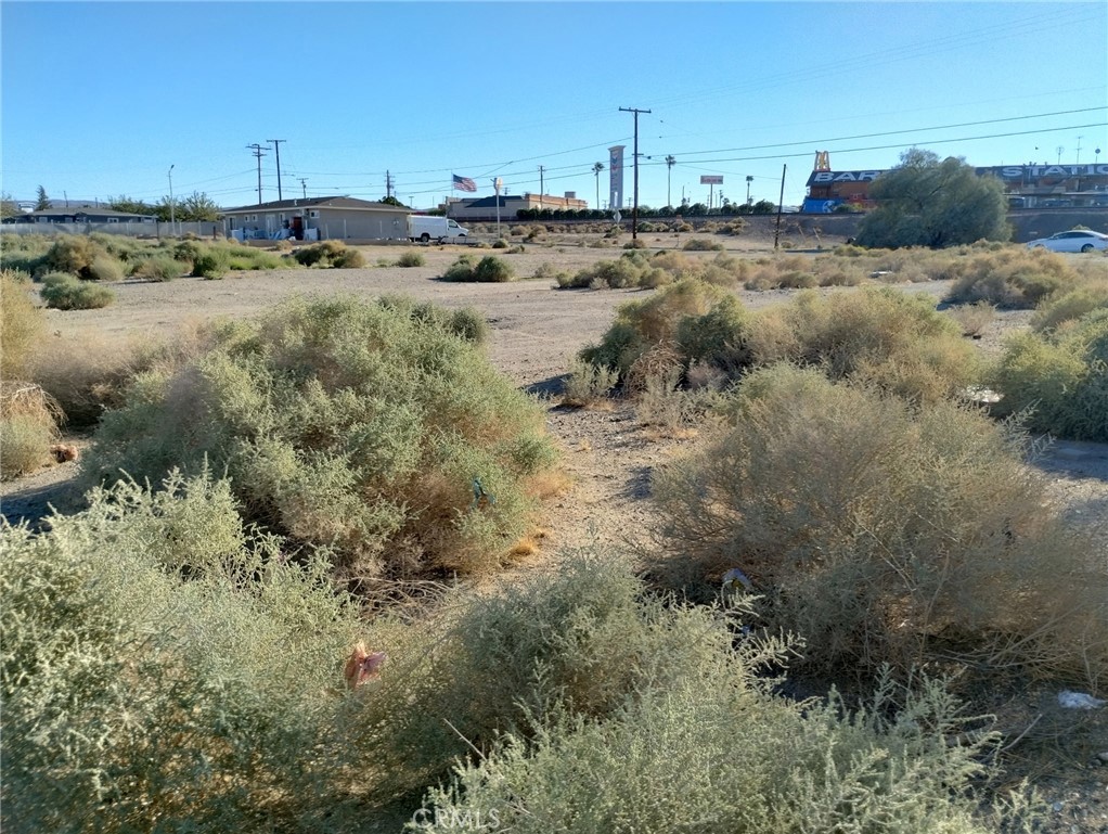1613 Riverside Drive Barstow, CA 92311 - Photo 3 of 14 a view of a town with trees in the background
