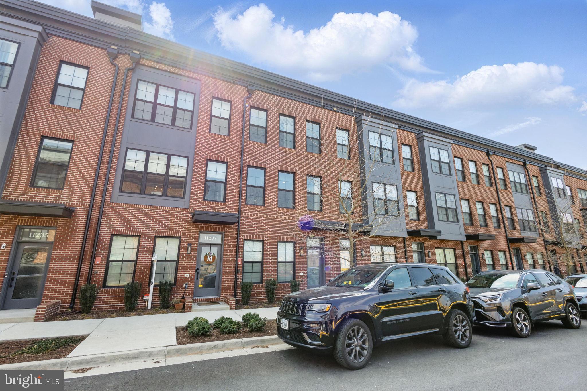 11239 Beaker Street Reston, VA 20190 - Photo 1 of 22 a car parked in front of a building