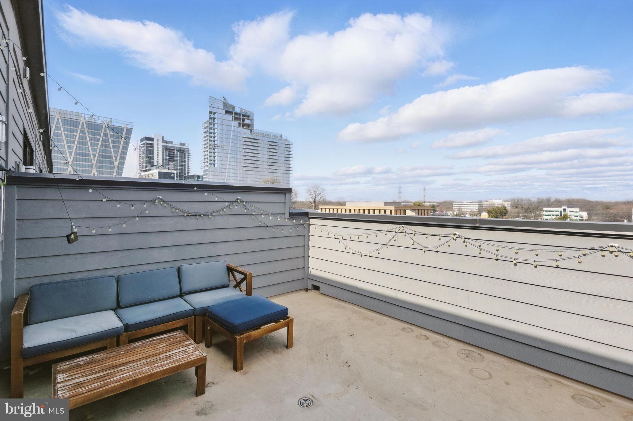 11239 Beaker Street Reston, VA 20190 - Photo 20 of 22 a view of a terrace with sitting area