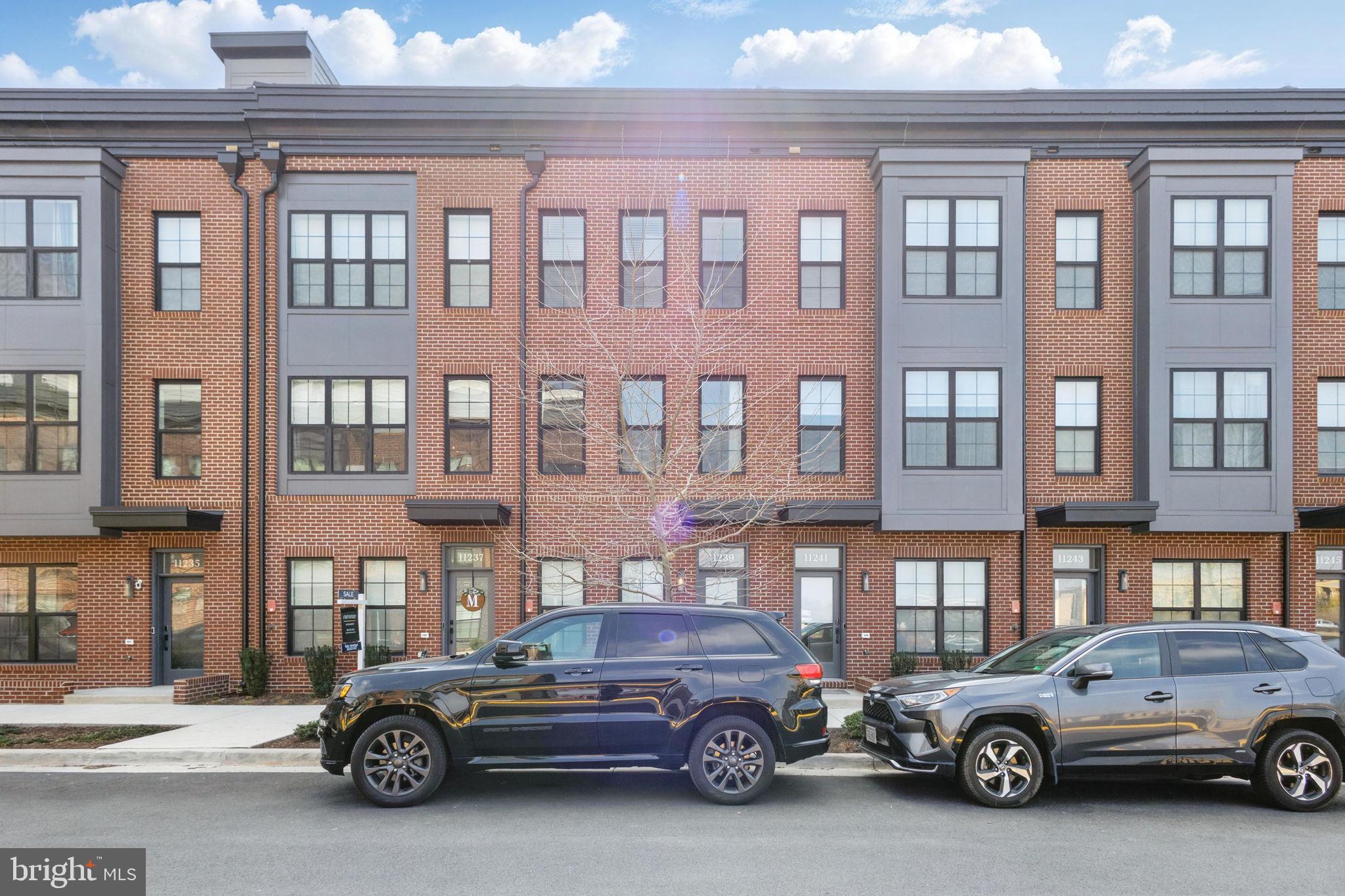 11239 Beaker Street Reston, VA 20190 - Photo 2 of 22 a car parked in front of a building