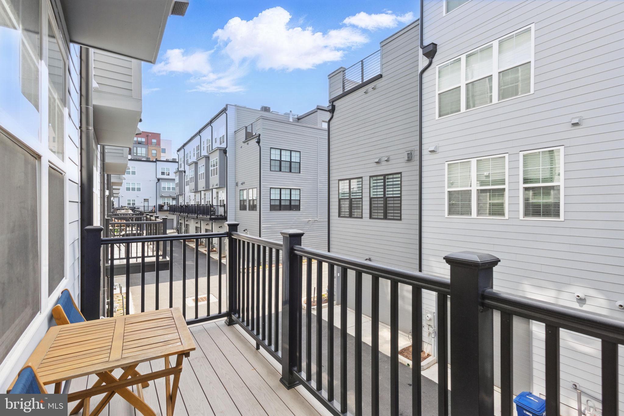 11239 Beaker Street Reston, VA 20190 - Photo 21 of 22 a view of a house with a wooden fence