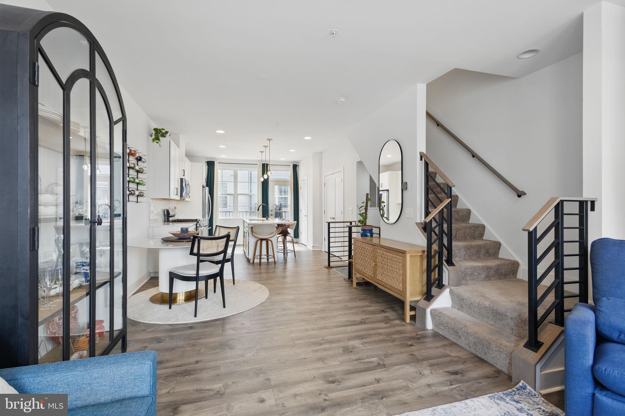 11239 Beaker Street Reston, VA 20190 - Photo 3 of 22 a living room with furniture and a wooden floor
