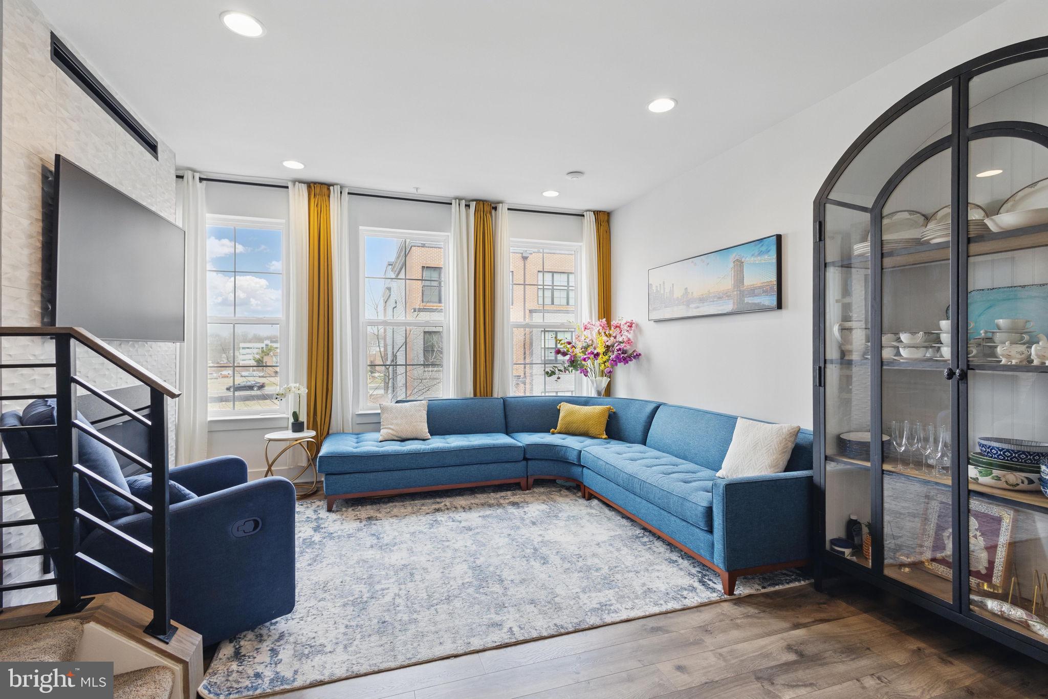 11239 Beaker Street Reston, VA 20190 - Photo 4 of 22 a living room with furniture and a large window