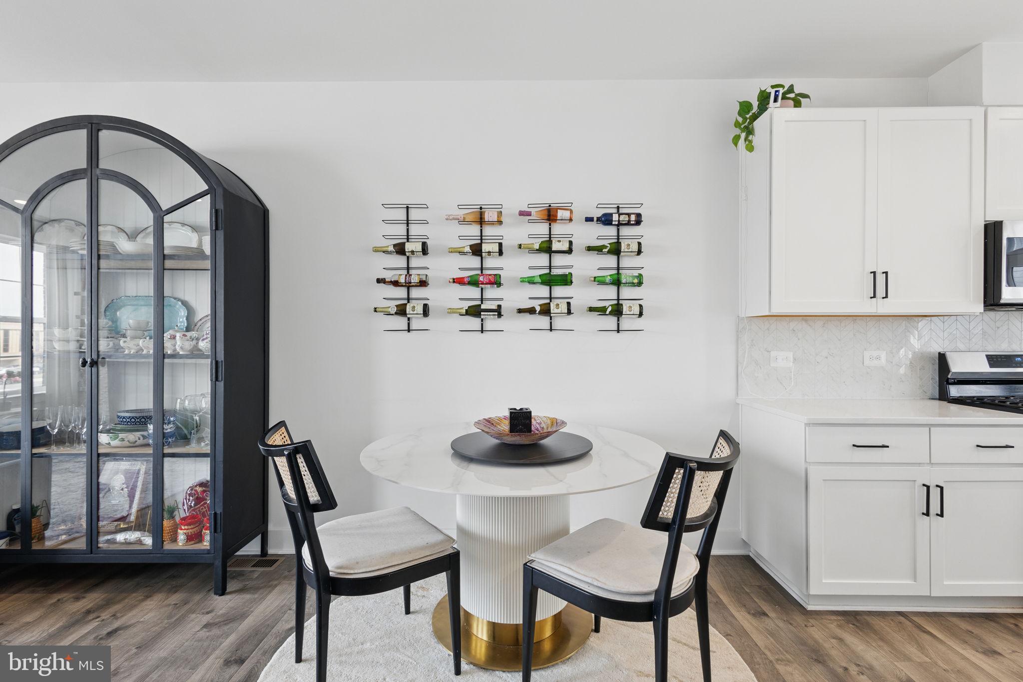 11239 Beaker Street Reston, VA 20190 - Photo 9 of 22 a dining room with furniture and window