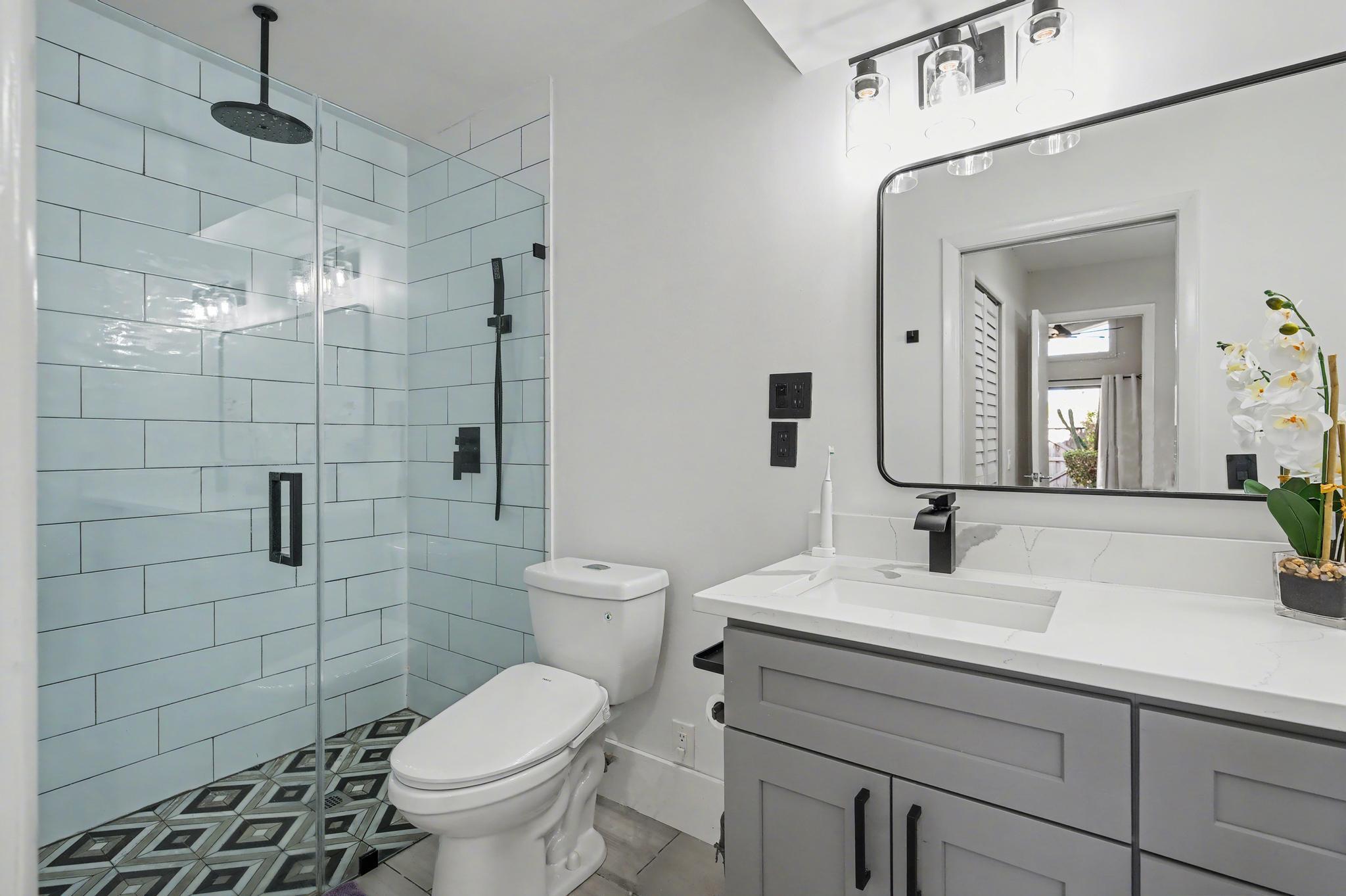 7855 Stanway Place Boca Raton, FL 33433 - Photo 14 of 25 a bathroom with a sink toilet and shower