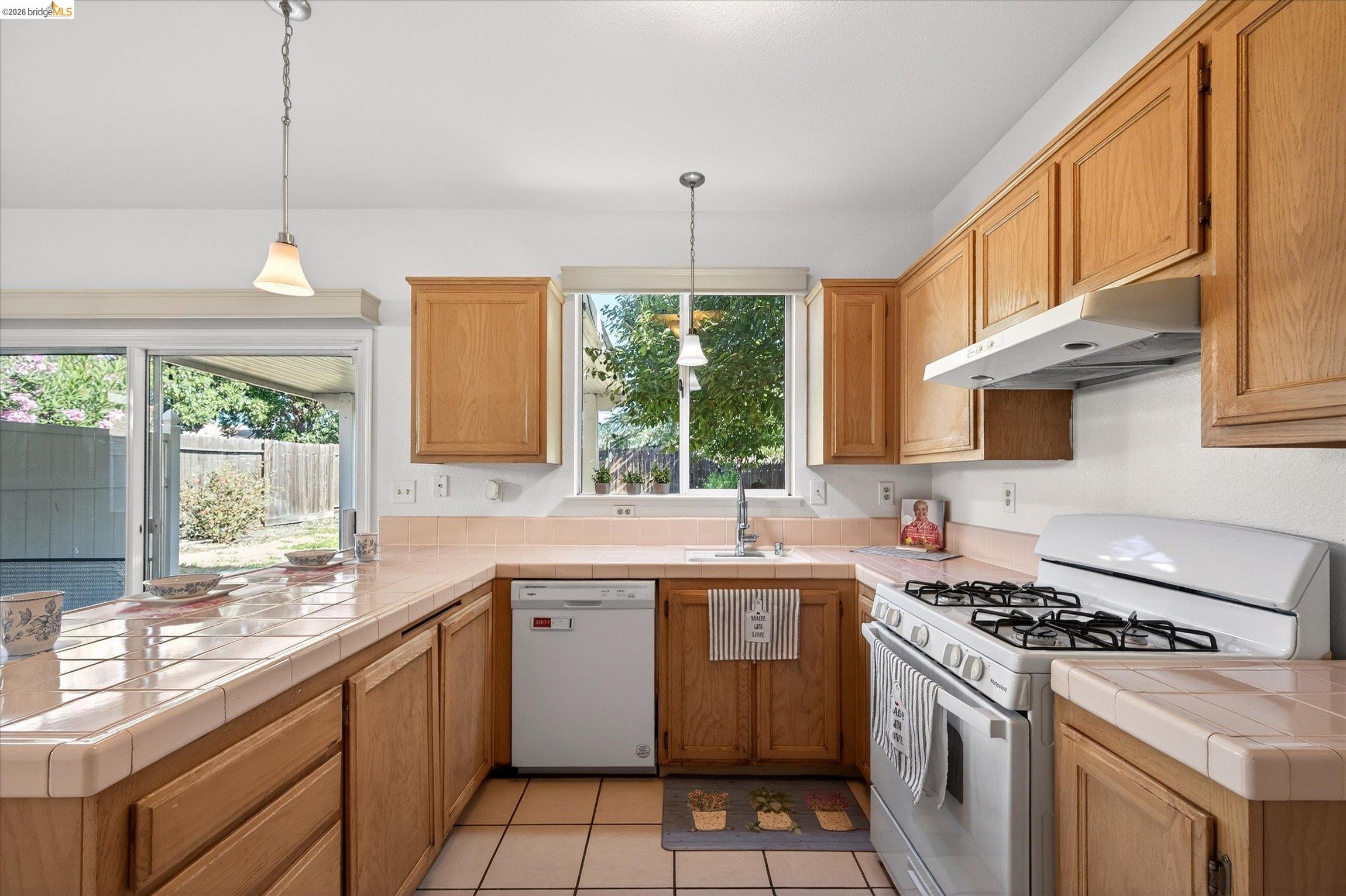 1120 Deerpark Road Oakley, CA 94561 - Photo 14 of 30 Kitchen featuring light wood cabinetry and light tile countertops