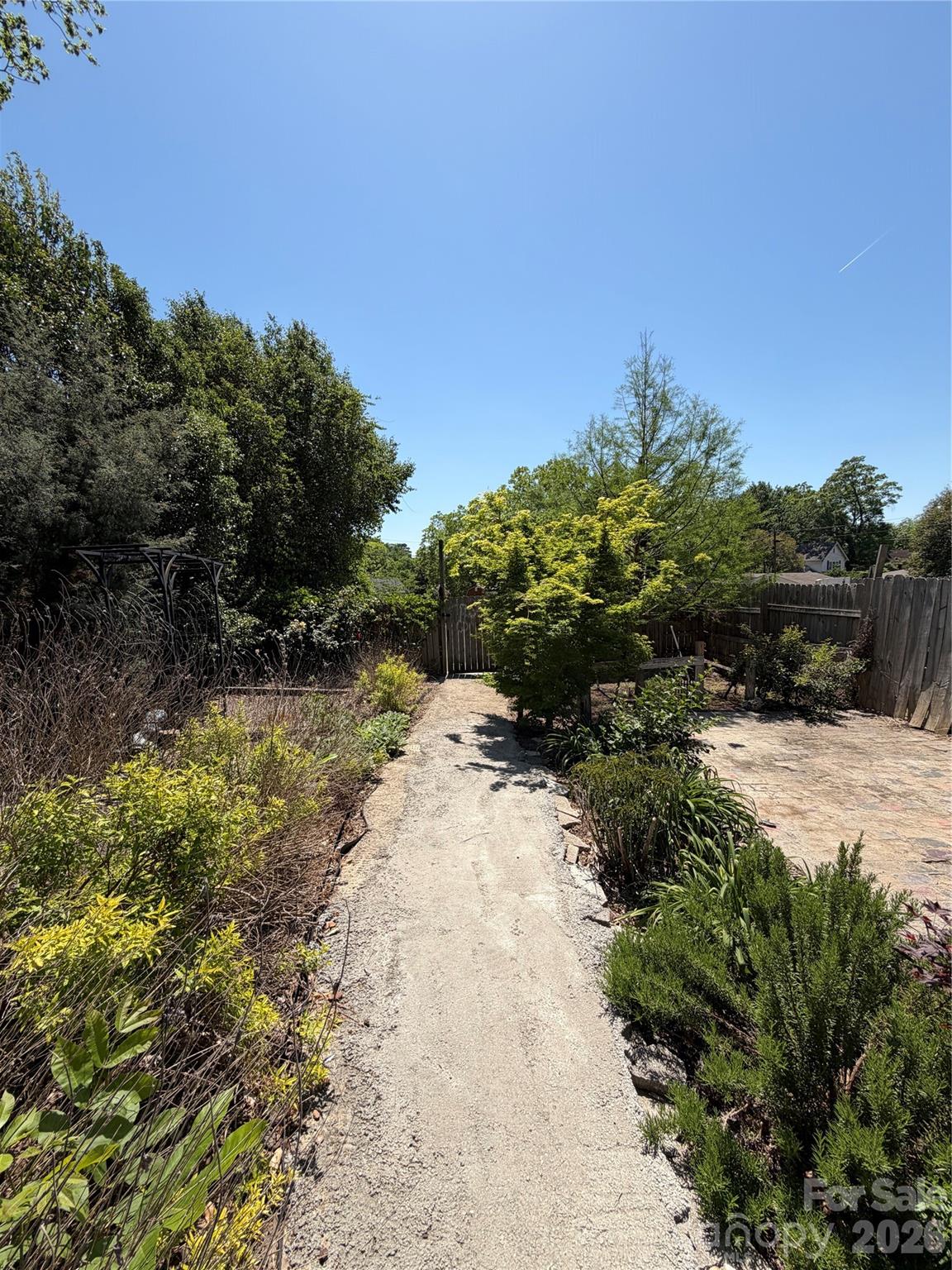 85 Falls Road Badin, NC 28009 - Photo 11 of 13 a view of a pathway with a yard