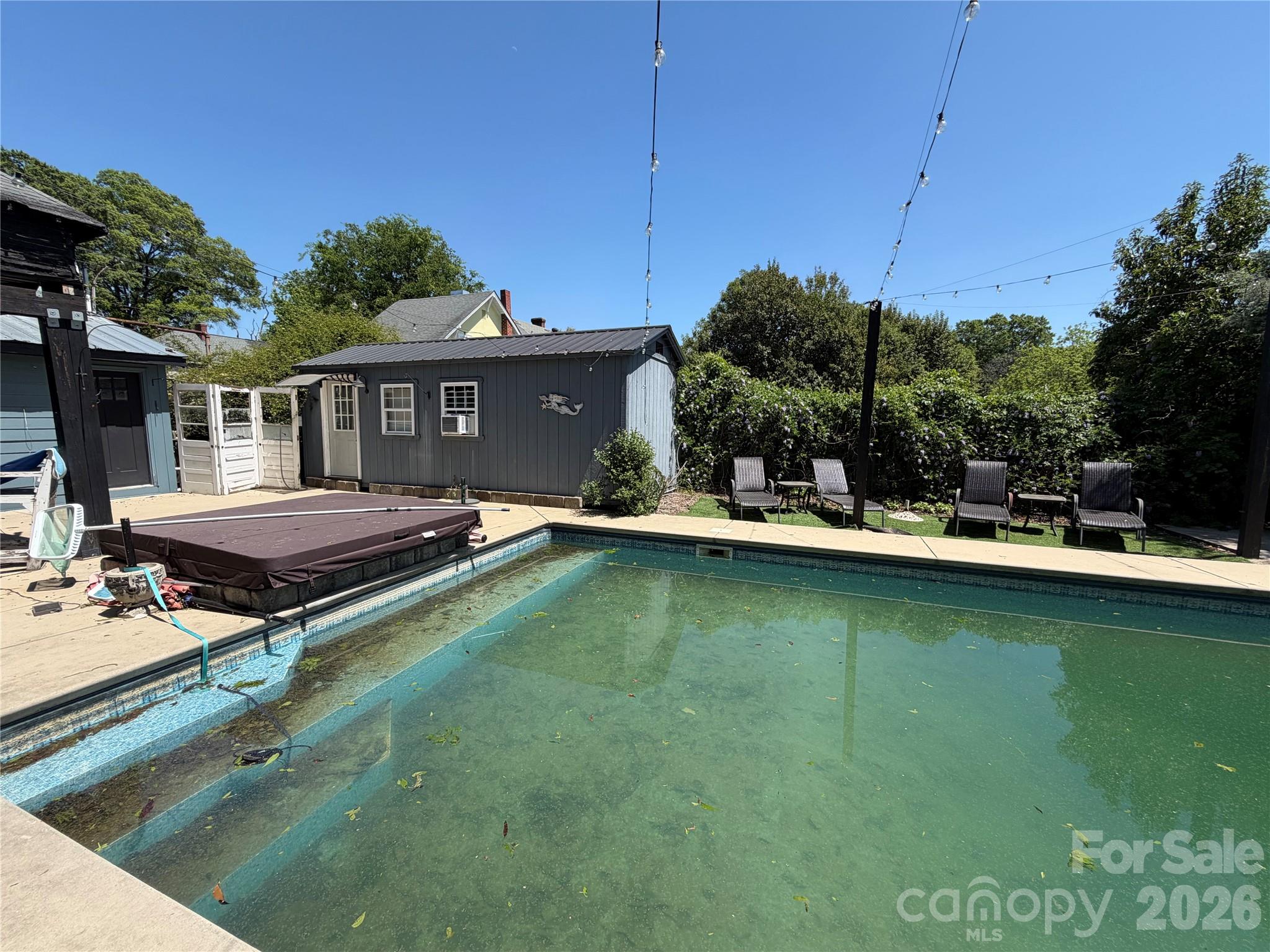 85 Falls Road Badin, NC 28009 - Photo 5 of 13 a view of a house with pool and chairs