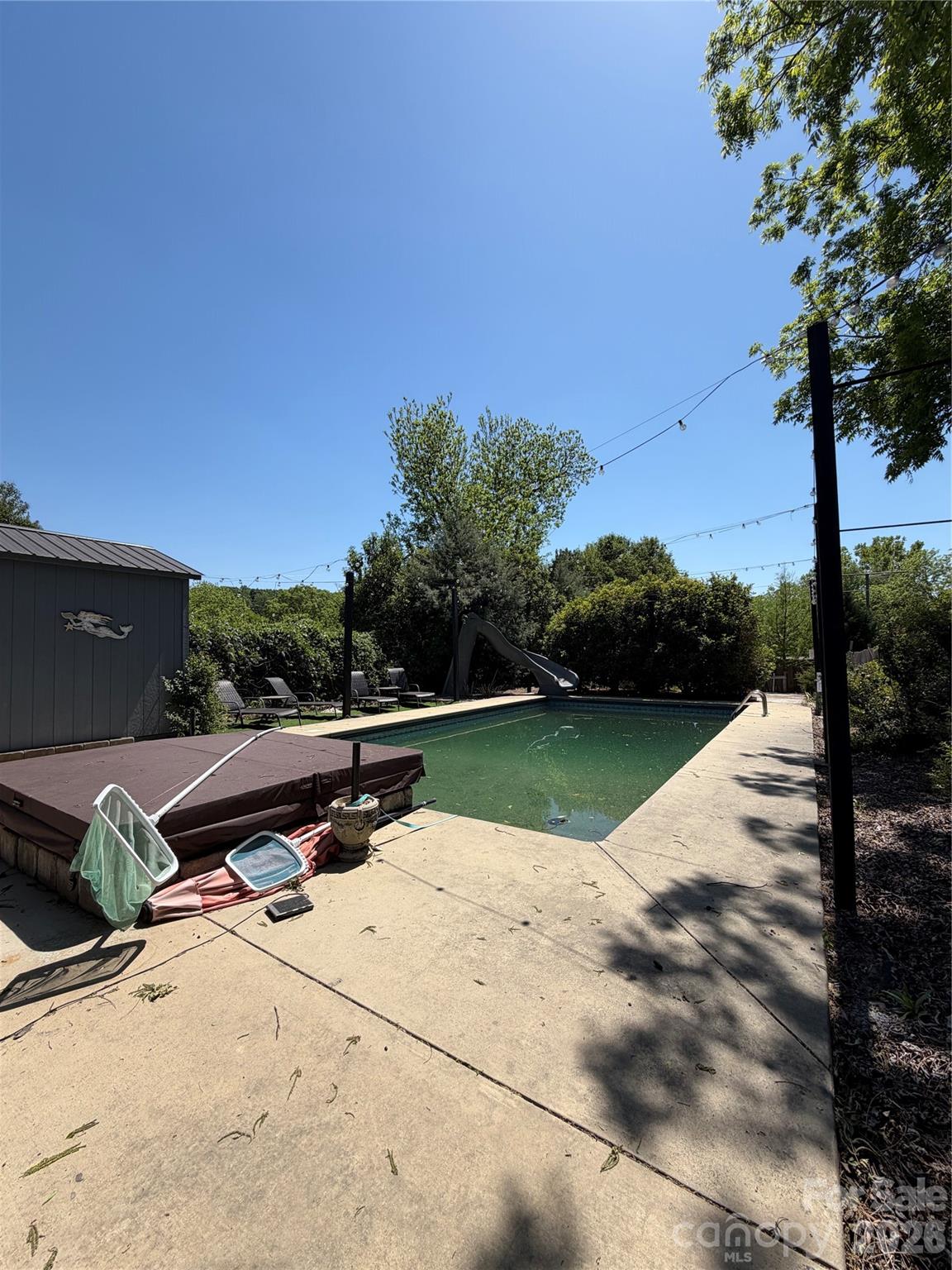 85 Falls Road Badin, NC 28009 - Photo 7 of 13 a view of swimming pool with outdoor seating and plants