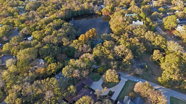 an aerial view of a house a yard and a garden