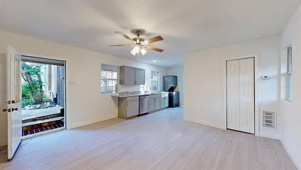 a kitchen with stainless steel appliances granite countertop a refrigerator and a sink