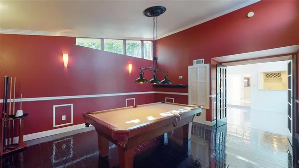 a view of a chairs and table in the balcony