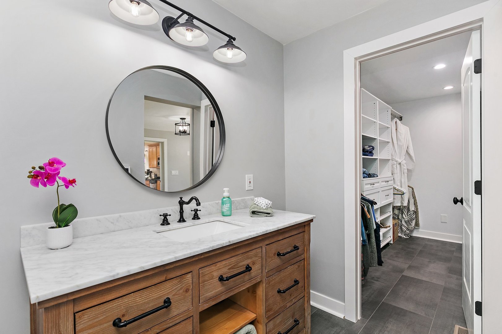 1037 North Harrison Street Algonquin, IL 60102 - Photo 17 of 46 a bathroom with a granite countertop double vanity sink and a mirror