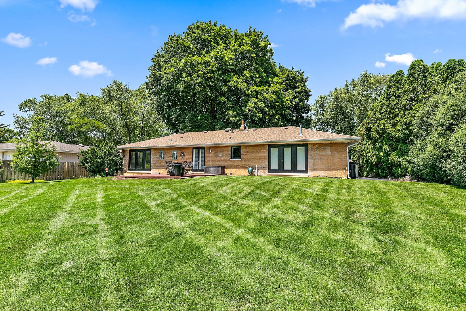 1037 North Harrison Street Algonquin, IL 60102 - Photo 26 of 46 a front view of a house with a garden