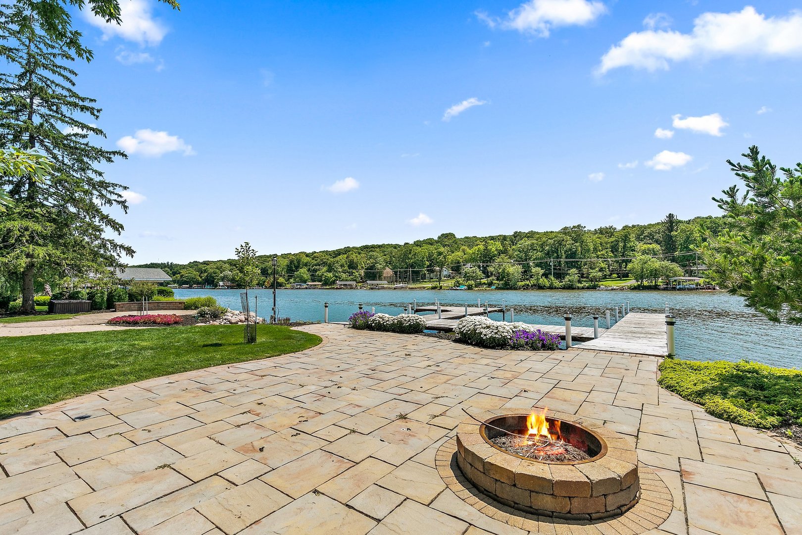 1037 North Harrison Street Algonquin, IL 60102 - Photo 28 of 46 a view of a backyard with table and chairs potted plants and large tree