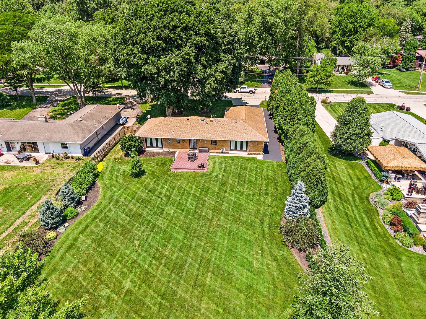 1037 North Harrison Street Algonquin, IL 60102 - Photo 43 of 46 an aerial view of residential house with outdoor space and trees all around