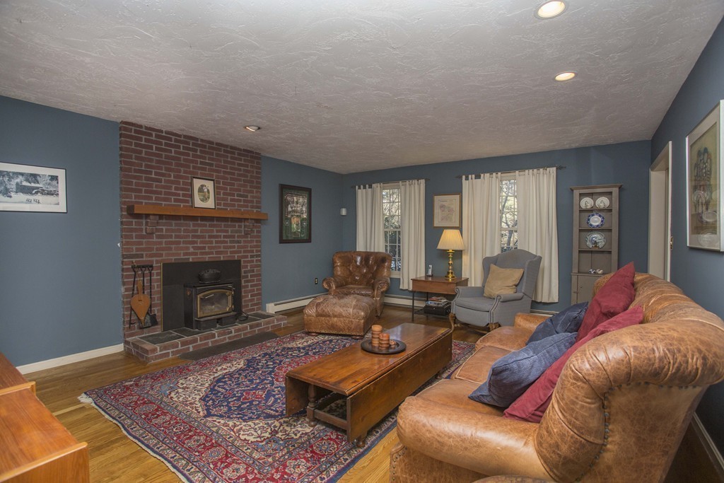 15 Virginia Ridge Road Sudbury, MA 01776 - Photo 4 of 16 a living room with furniture and a fireplace