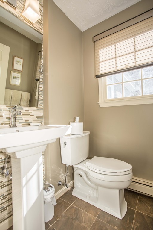 15 Virginia Ridge Road Sudbury, MA 01776 - Photo 8 of 16 a bathroom with a toilet a sink and a window