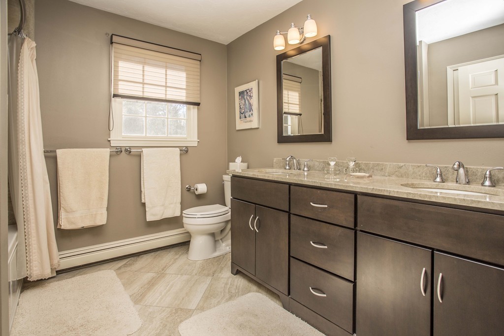 15 Virginia Ridge Road Sudbury, MA 01776 - Photo 9 of 16 a bathroom with a toilet sink and mirror
