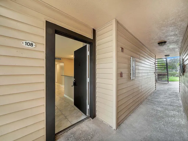 an aerial view of a house with a swimming pool