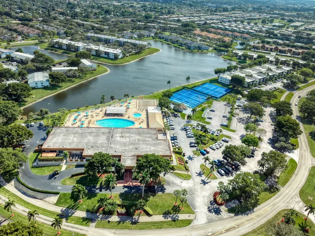 an aerial view of a house with a swimming pool