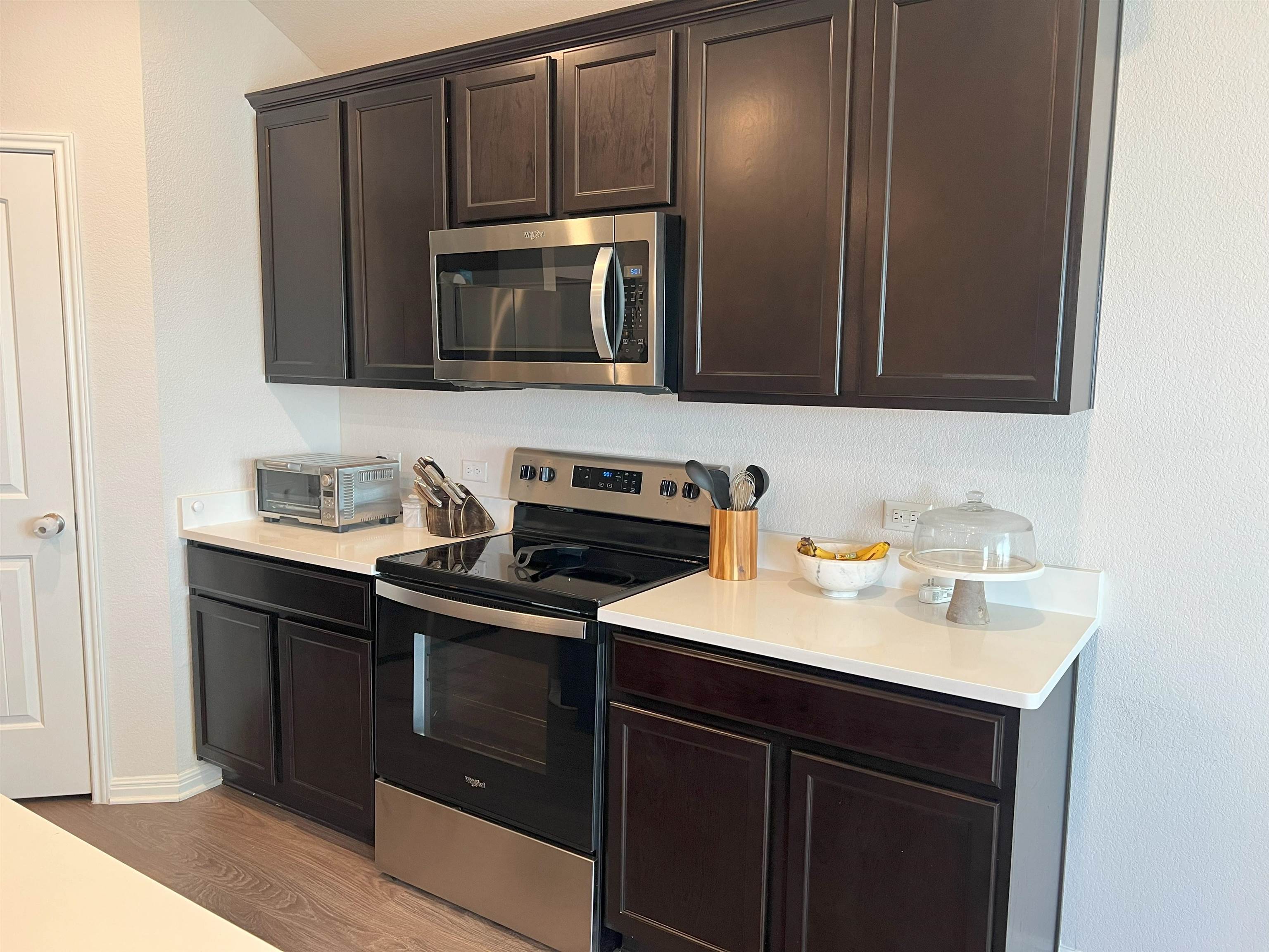 248 Lone Cedar Road Marble Falls, TX 78654 - Photo 11 of 30 a kitchen with a sink stove and microwave