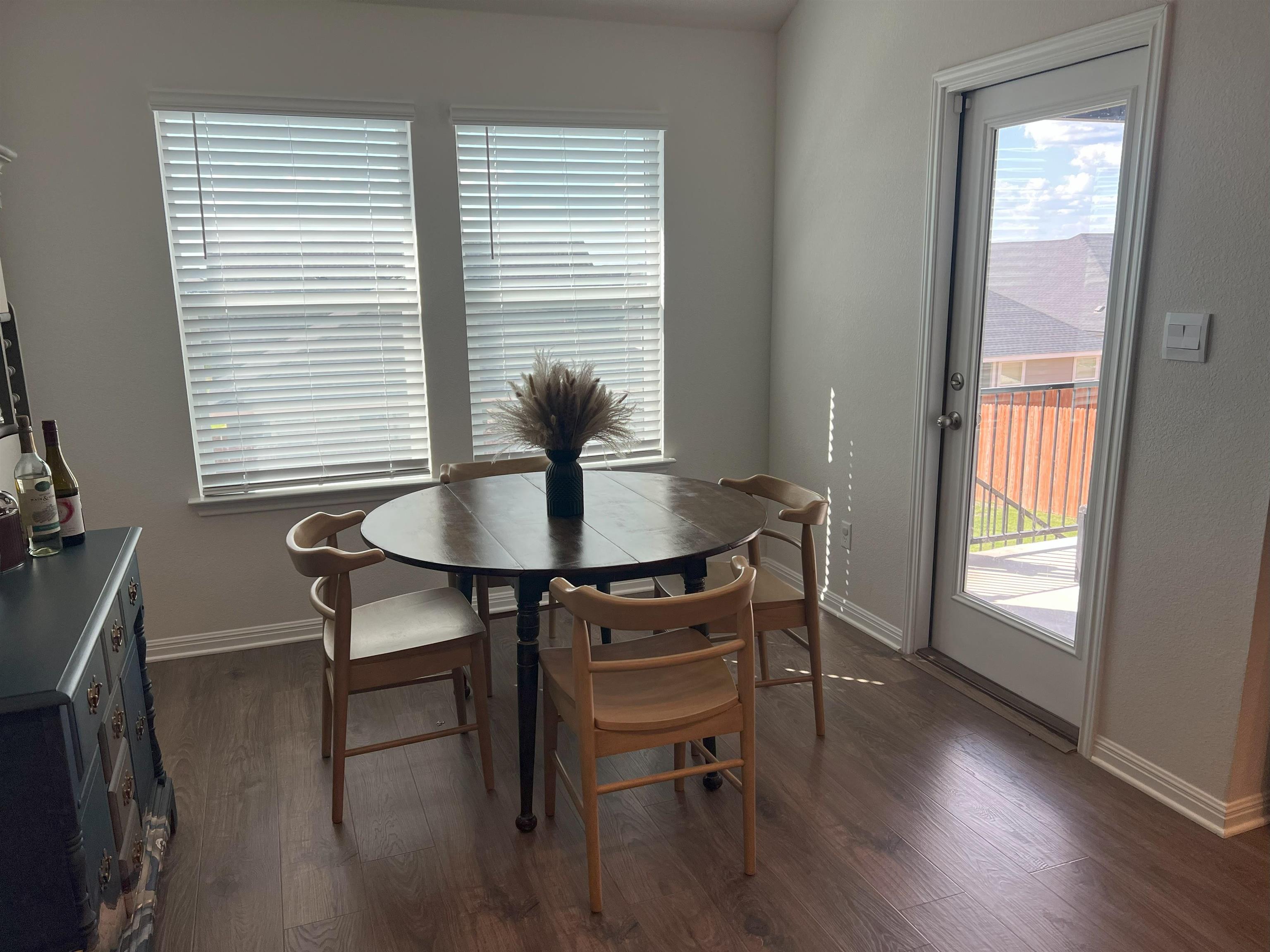 248 Lone Cedar Road Marble Falls, TX 78654 - Photo 16 of 30 a view of a dining room with furniture and wooden floor