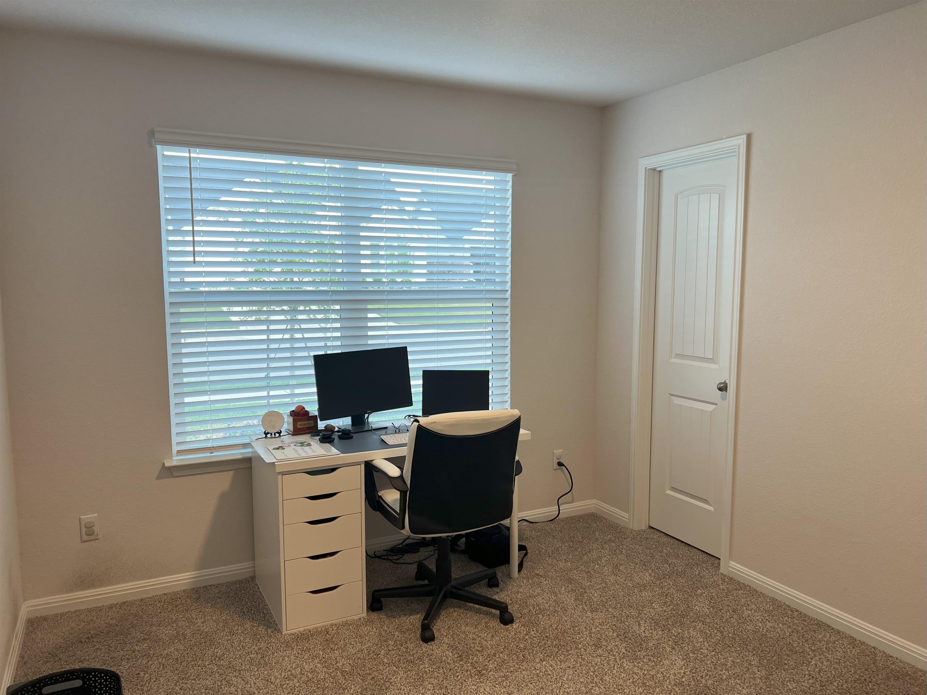 248 Lone Cedar Road Marble Falls, TX 78654 - Photo 24 of 30 a view of a workspace with furniture and a window